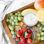 variety of fruits with dip on tray